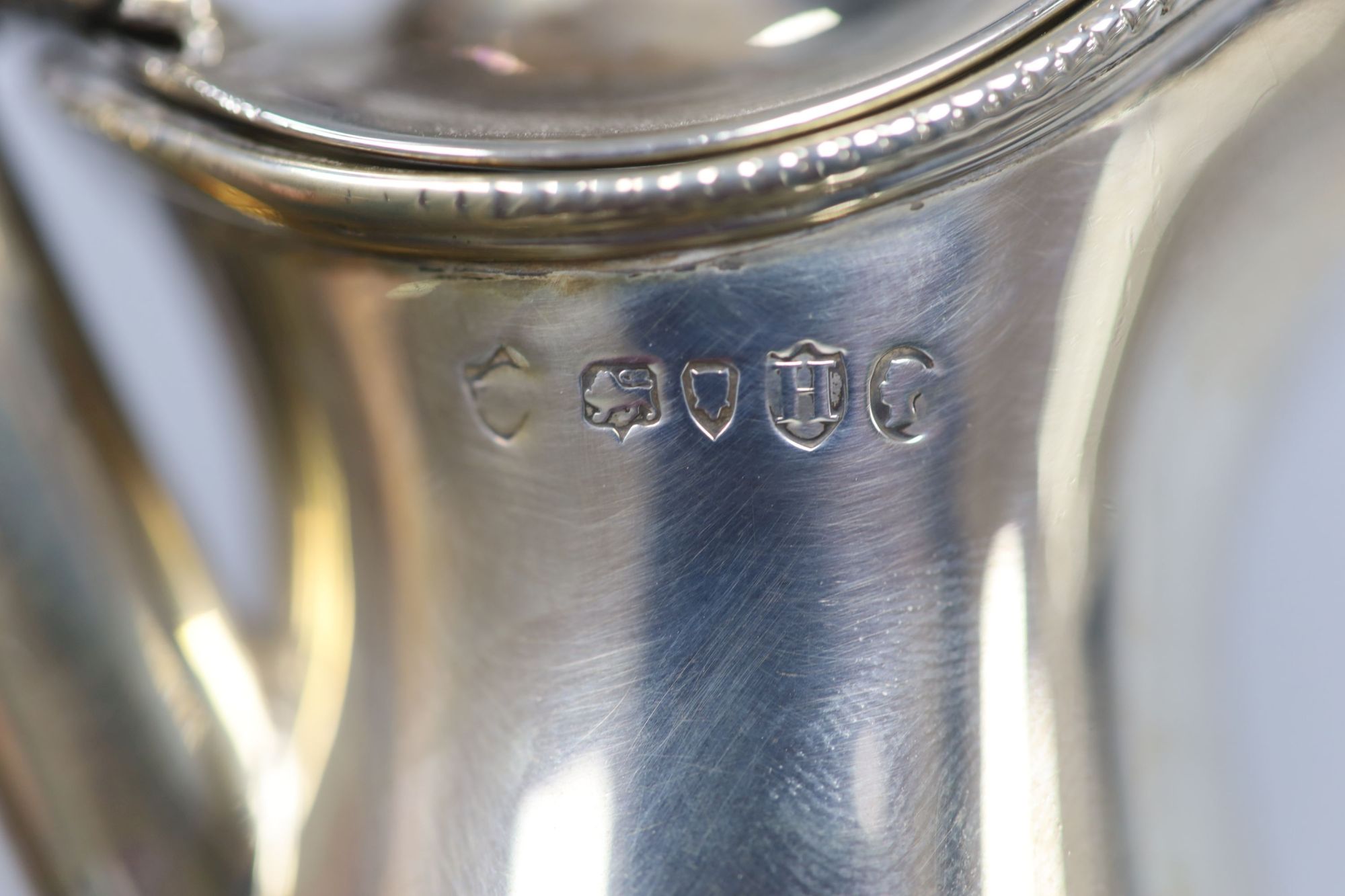 A late Victorian silver hot water pot, London, 1883, makers mark rubbed, height 26.1cm, gross 12.5oz.